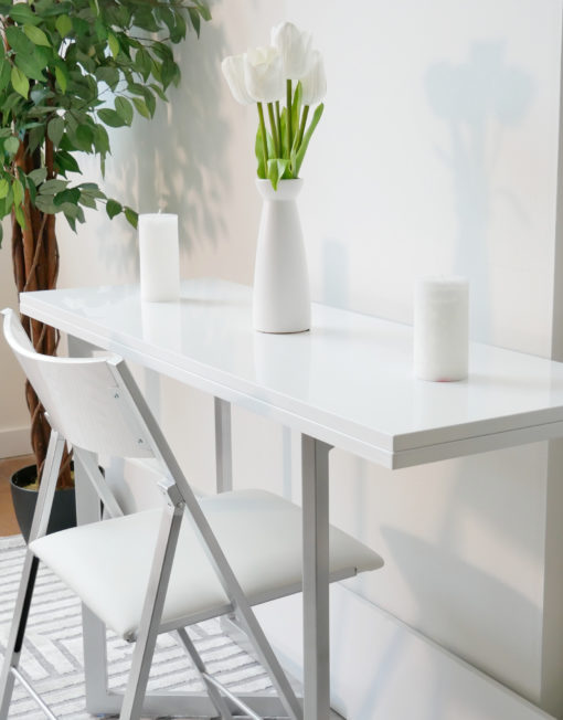 Flip-console-closed-in-glossy-white-being-used-as-a-small-desk-with-transforming-options