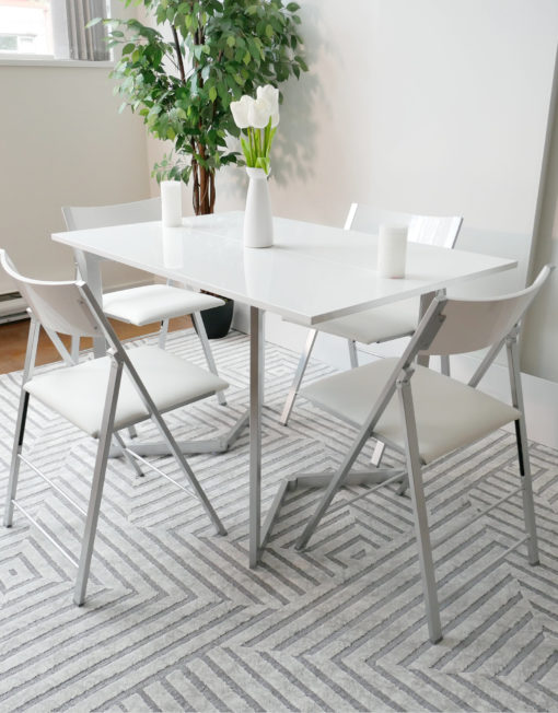 Flip-console-to-dining-table-in-glossy-white-opened-in-dining-form-with-4-nano-chairs-in-a-modern-room-with-grey-carpet