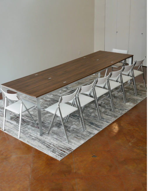 mega-abode-super-extended-14-person-table-in-chocolate-walnut-with-silver-legs-and-nano-chairs-around-it